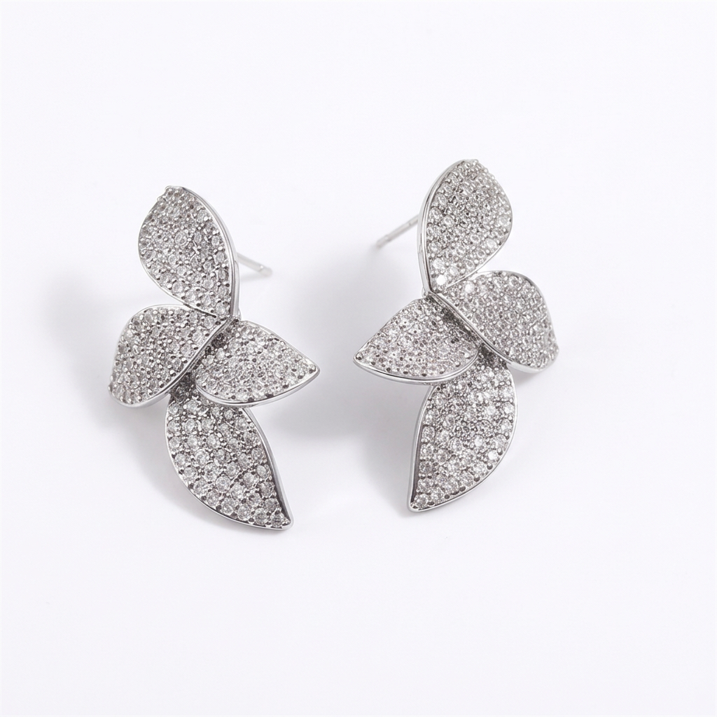 Silver leaf earrings on a white background