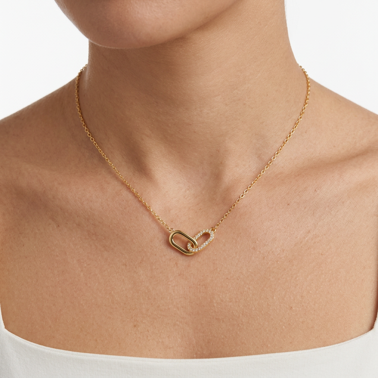 Gold link necklace worn on a model’s neck