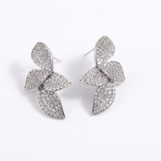 Silver leaf earrings on a white background